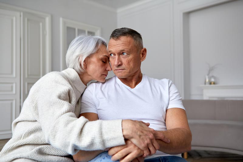 Mature couple sitting in living room