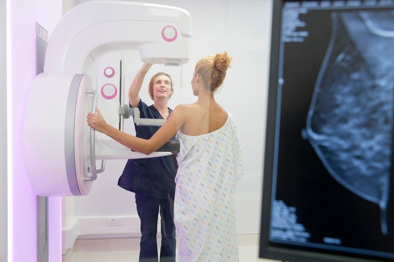Woman getting mammogram in medical office