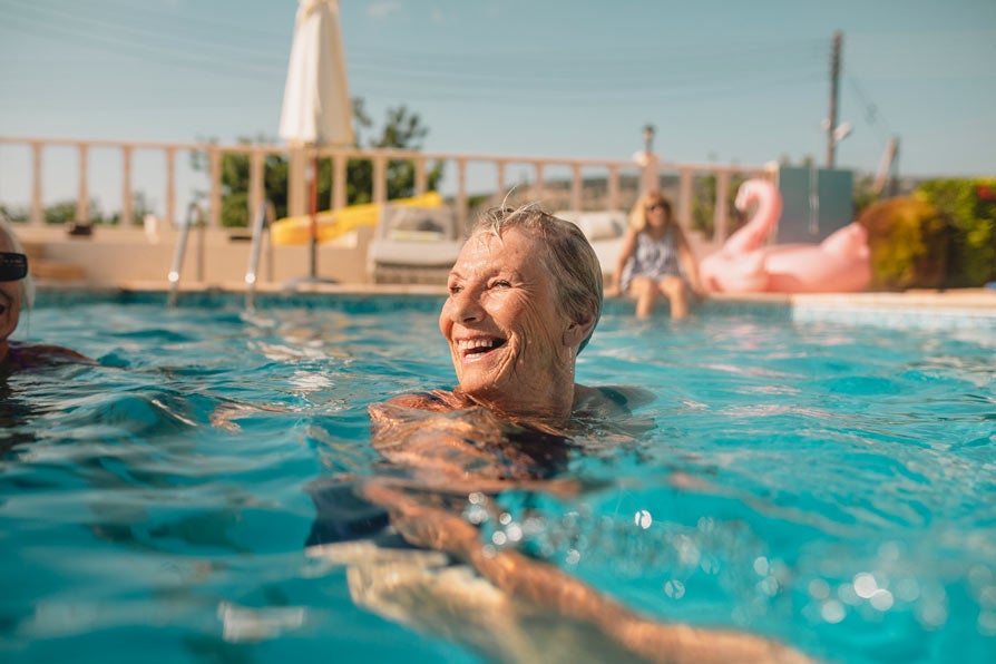 Woman swimming in pool