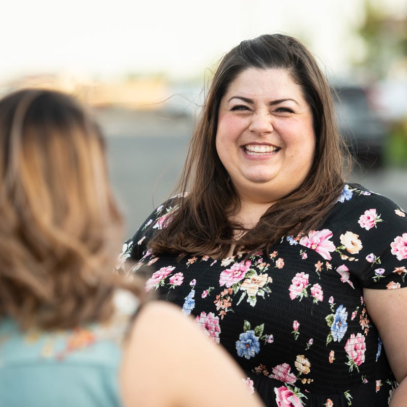 Woman laughing with a friend