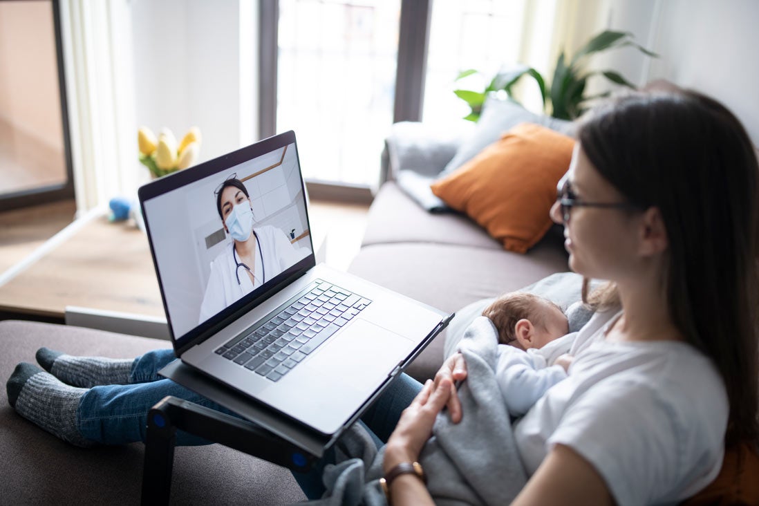 Mom with newborn at online appointment