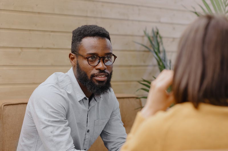 Young man talking with a therapist