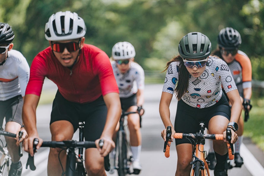 Group of bicyclists racing on a rural road